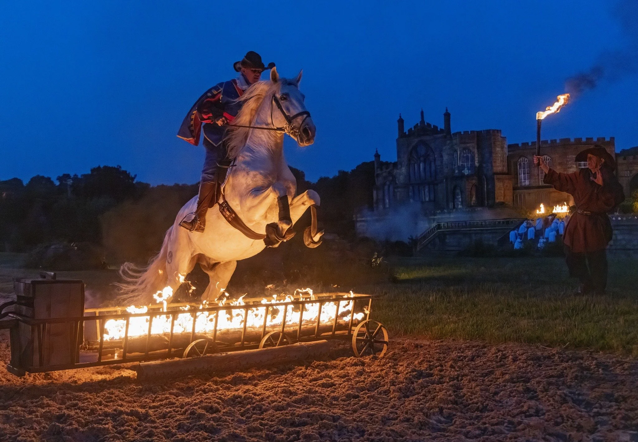 Horse and rider leaping through fire at Kynren